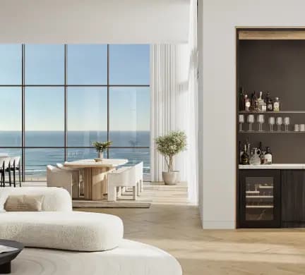 Elegant living room with neutral tones, a cozy sofa, and a breathtaking view of the ocean through large windows.”