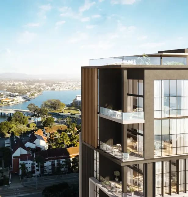 Modern apartment building featuring sleek architectural lines and large balconies, set against a cityscape.